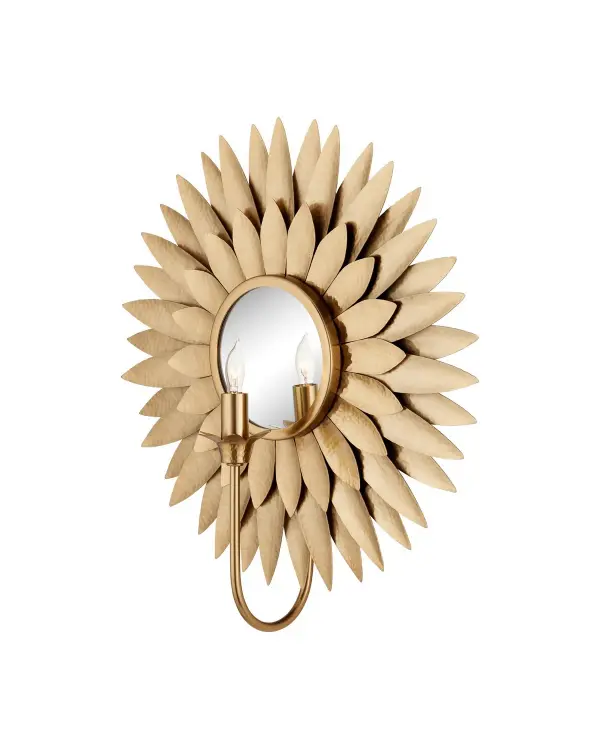 The Plumage Wall Sconce features handcrafted hammered brass leaves arranged in a circular pattern, creating dimensional visual interest. The antique brass finish and mirror backplate enhance light reflection while adding warmth and sophistication.