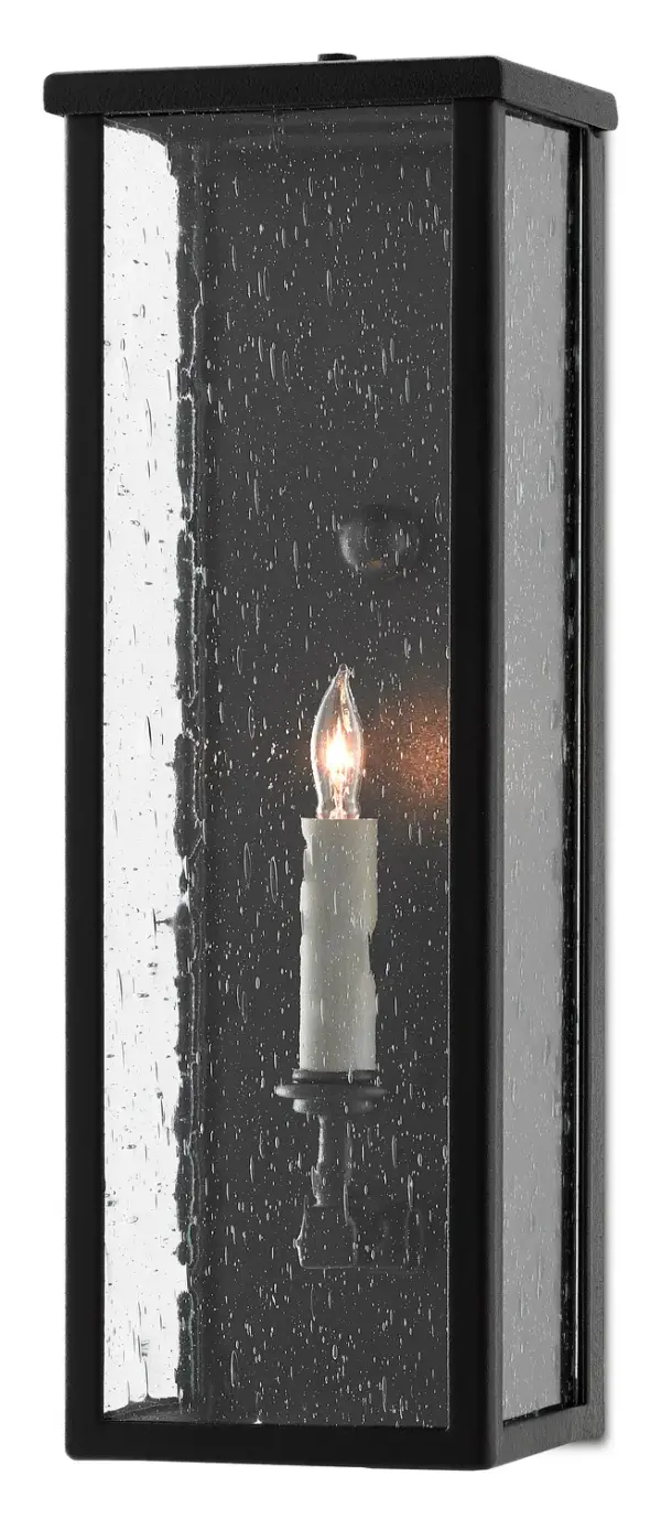 The Tanzy Small Outdoor Wall Sconce combines traditional styling with modern durability. Its Trilux finish offers superior weather resistance with a 5-year guarantee, while seeded glass adds vintage charm to any exterior space.
