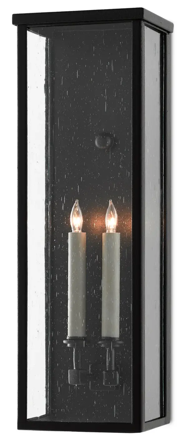 The Tanzy wall sconce combines traditional lantern styling with modern durability. Its Trilux finish offers superior weather resistance with a 5-year guarantee, while seeded glass panels add vintage charm to outdoor spaces.