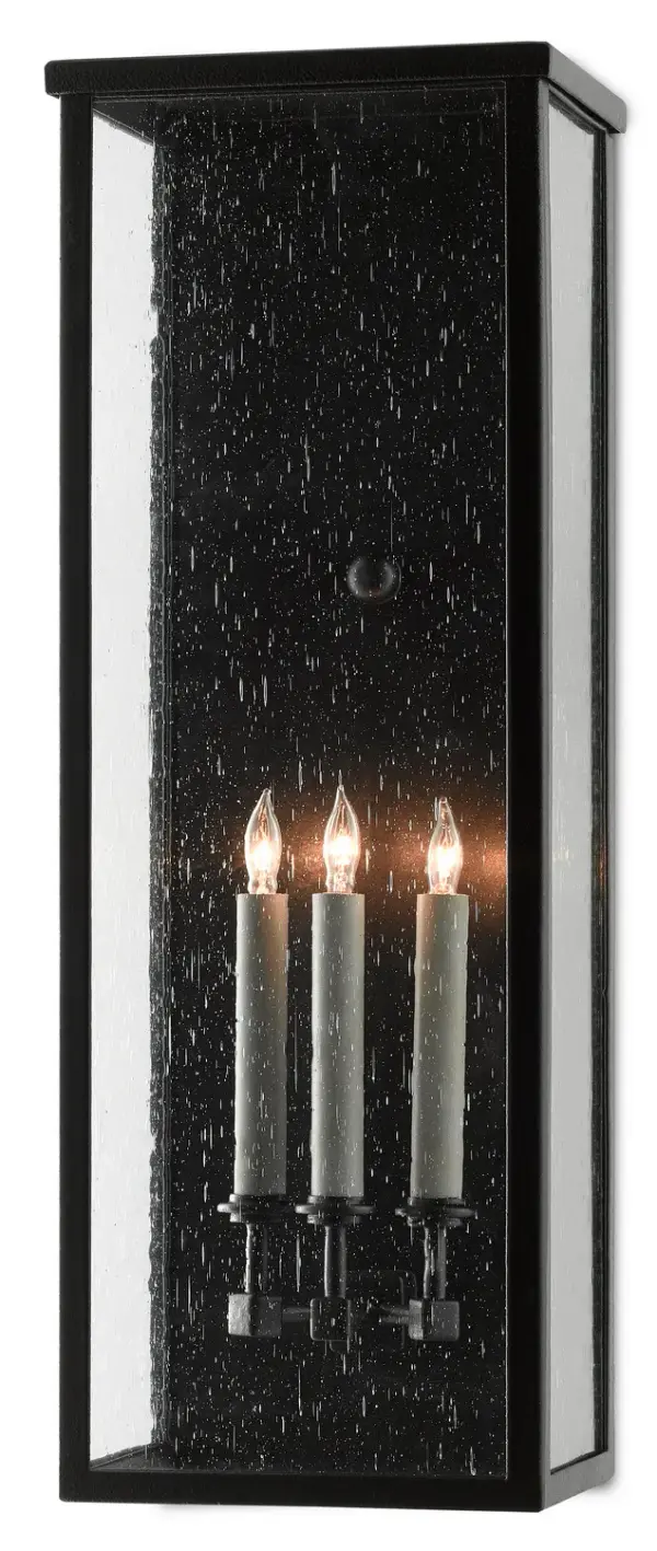 The Tanzy wall sconce combines traditional lantern styling with modern durability. Its Trilux finish offers superior weather resistance with a 5-year guarantee, while seeded glass panels add vintage charm to outdoor spaces.
