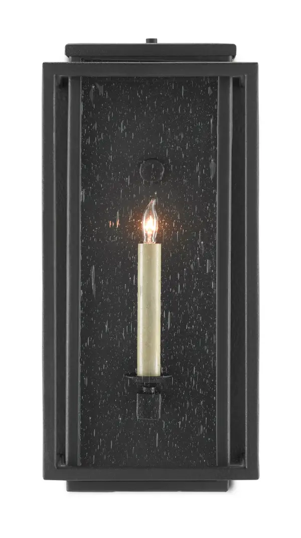 The Wright sconce combines mission-style design with modern durability. Its wrought iron frame and seeded glass create warm, textured light while the Trilux finish ensures long-lasting performance in outdoor conditions.
