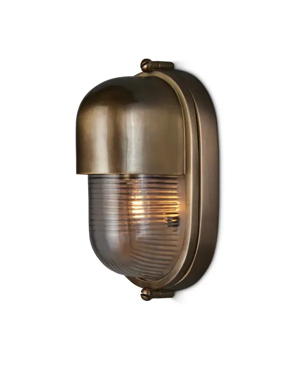 A compact outdoor wall sconce that brings maritime elegance to coastal and traditional homes. The antique brass finish and ribbed glass shade evoke luxury yacht styling while providing weather-resistant durability.