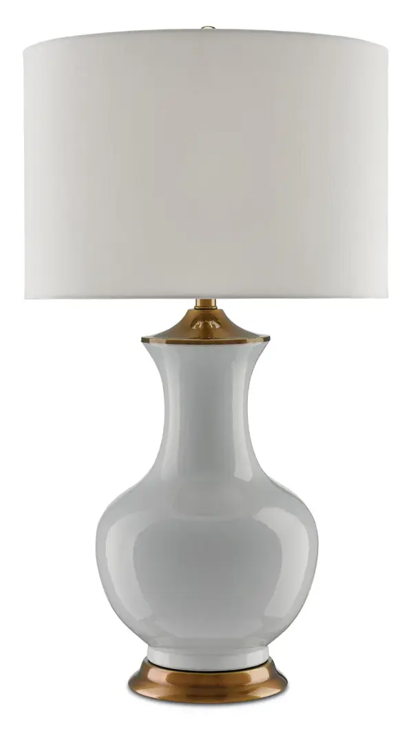 The Lilou table lamp combines classic ceramic craftsmanship with refined brass hardware for a serene, sophisticated presence. Its vase-like silhouette and neutral palette make it versatile across traditional and contemporary interiors.