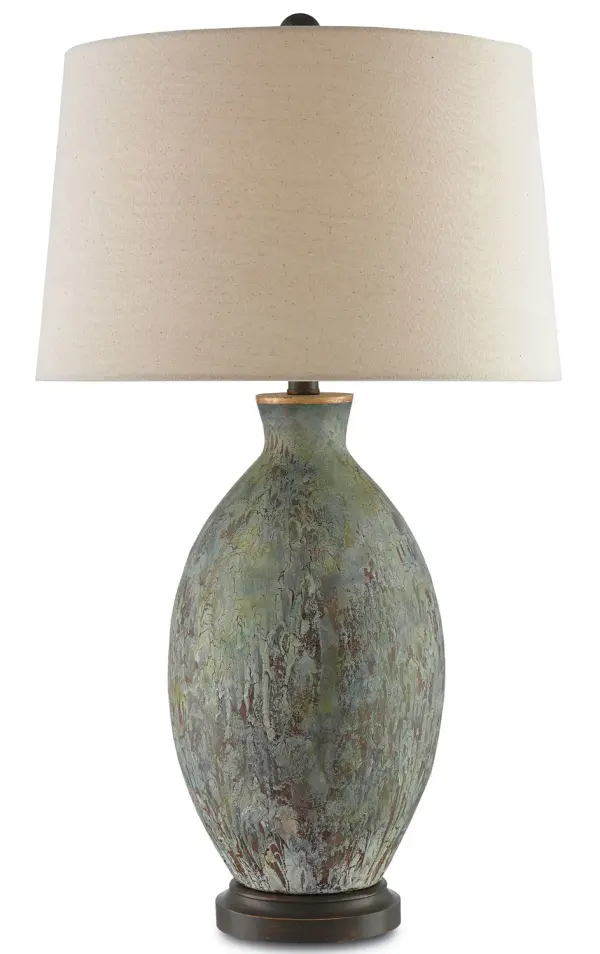 The Remi Table Lamp showcases handcrafted terracotta with dripped green and dark red glazes that create a unique aged copper aesthetic. Bronze gold hardware complements the organic patina, while the flax linen shade softens the light for ambient warmth.