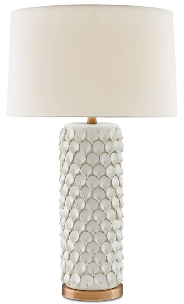 The Calla Lily Table Lamp showcases intricate hand-formed ceramic flower petals that create stunning textural interest. Antique brushed-brass accents complement the cream ceramic base, while the eggshell shantung shade softens the light beautifully.