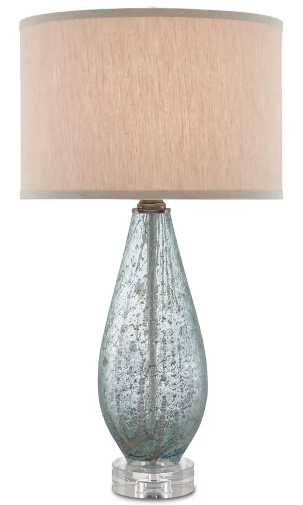 The Optimist brings serene coastal style with its pale blue speckled glass body and optic crystal base. The natural linen shade softens the light while complementing the organic glass texture. A sophisticated choice for bedrooms and living spaces.