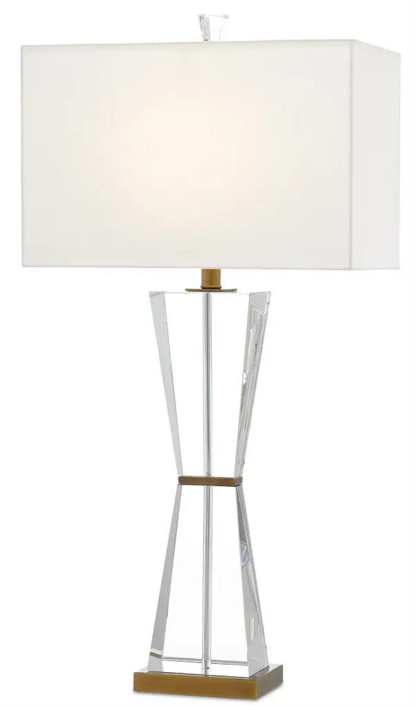 The Laelia combines optic crystal panels with warm antique brass for a refined, luminous presence. Its substantial 34-inch height and crystal finial add architectural interest while the off-white shade provides soft, diffused light.