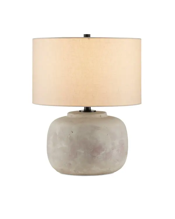 The Beton Table Lamp brings raw industrial elegance with its hand-distressed concrete body and warm linen shade. At 20 inches tall, it's perfectly scaled for living spaces and bedrooms, offering substantial presence without overwhelming.