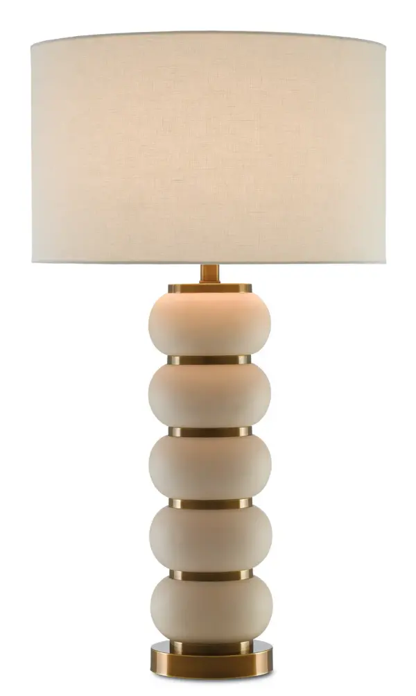 The Luko Table Lamp features a distinctive stacked ceramic sphere design in ivory with antique brass accents. Its sculptural form and quality materials make it a statement piece that works across traditional and contemporary interiors.
