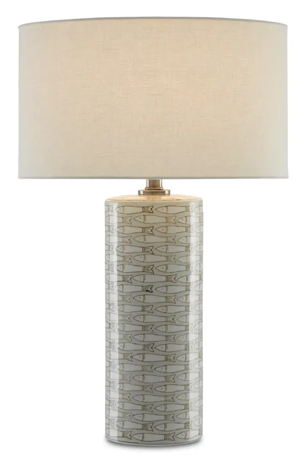 The Fisch Table Lamp brings a sophisticated coastal aesthetic with its hand-glazed gray and white fish pattern on clean-lined porcelain. The antique nickel hardware complements the neutral palette, while the off-white linen shade softens the light for ambient illumination.