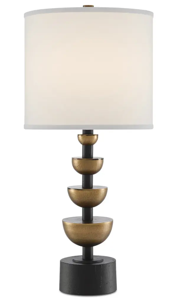The Chastain table lamp makes a bold statement with its architectural design featuring graduated halved orbs along the stem. The striking contrast of antique brass and matte black finishes creates visual interest.