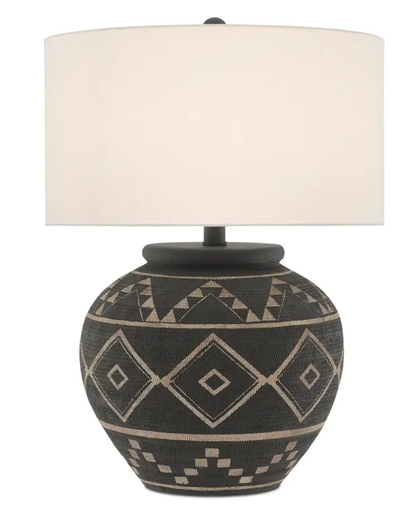 The Tattoo Table Lamp showcases exceptional craftsmanship with its hand-scratched basket-weave pattern on a terracotta body. The sophisticated black and latte finish creates visual depth, while the off-white linen shade provides warm, diffused light. A statement piece that bridges traditional artisan techniques with contemporary design sensibilities.