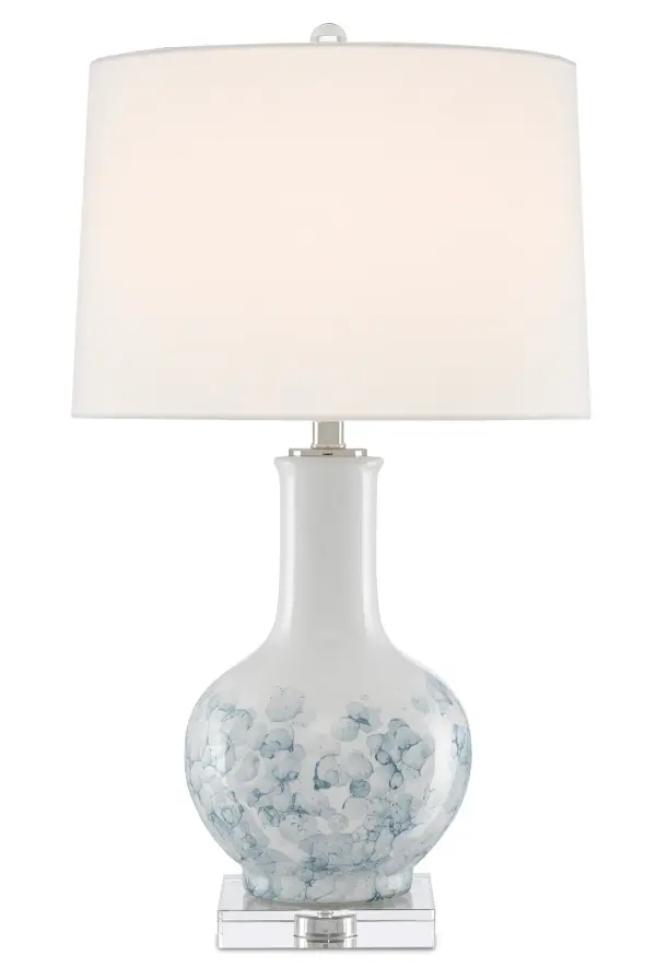 The Myrtle Table Lamp combines white and blue ceramic with delicate floral patterns and a clear crystal base for a refined, feminine aesthetic. The polished nickel hardware and linen shade add sophistication to any space.