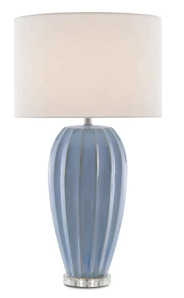 The Bluestar Table Lamp combines artisanal porcelain craftsmanship with luxe crystal detailing. Its cornflower blue ridged surface and clear optic crystal base create sophisticated visual interest, while the classic white shade ensures versatility.