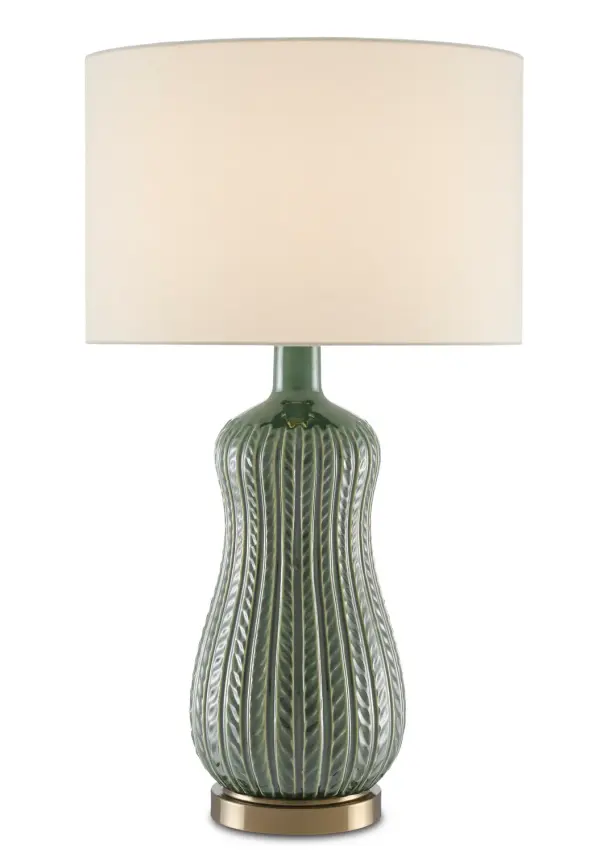 The Mamora table lamp combines artisanal ceramic craftsmanship with a sophisticated green glaze and leafy trellis pattern. Its peanut-shaped silhouette and antique brass base create a refined focal point for traditional and transitional interiors.