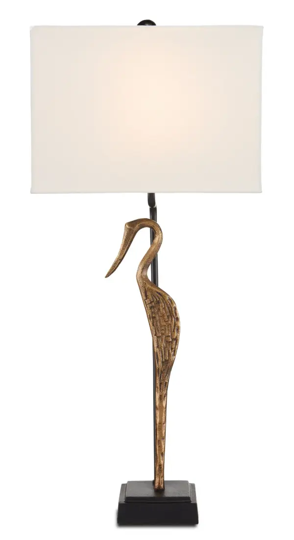 The Antigone Table Lamp transforms a wading bird silhouette into sophisticated lighting art. Its cast aluminum construction and dual-finish design create visual interest while the bone linen shade provides warm, diffused light.