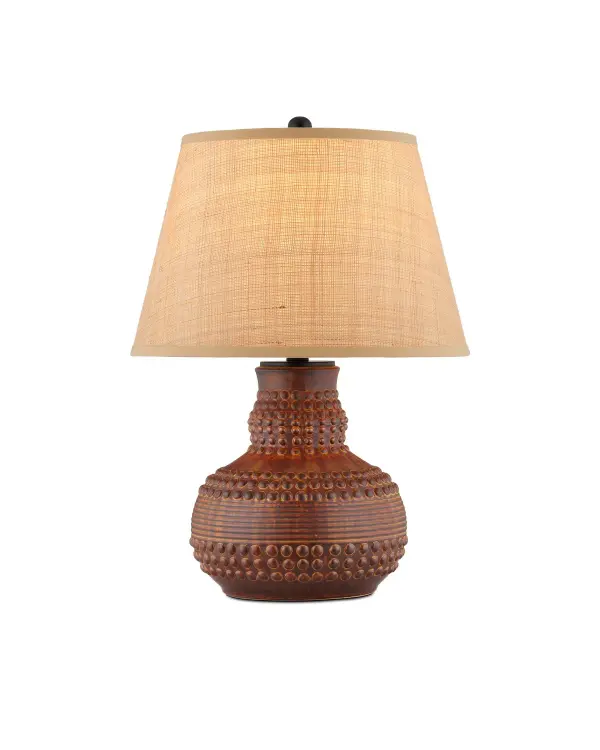 The Atamo Table Lamp brings distinctive character with its medicine rattle-inspired ceramic form and rich dark brown glazing. The textured surface paired with natural raffia shade creates visual depth and warmth.