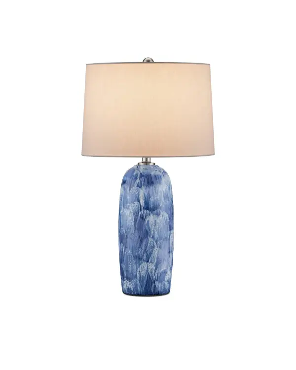 The Pallas Table Lamp showcases exceptional artisan craftsmanship with painterly brush strokes and textured glazing. Its handmade ceramic body features flowing white-on-blue patterns with organic bubbling effects that add depth and character.