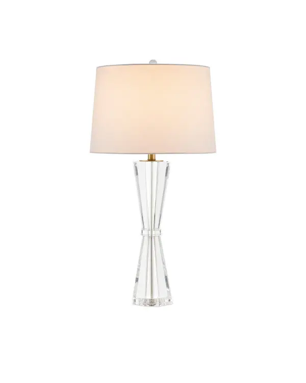 The Duveen combines optic crystal clarity with polished brass accents in a distinctive hourglass silhouette. Its substantial presence and luminous materials create visual impact even when unlit, making it ideal for formal spaces.