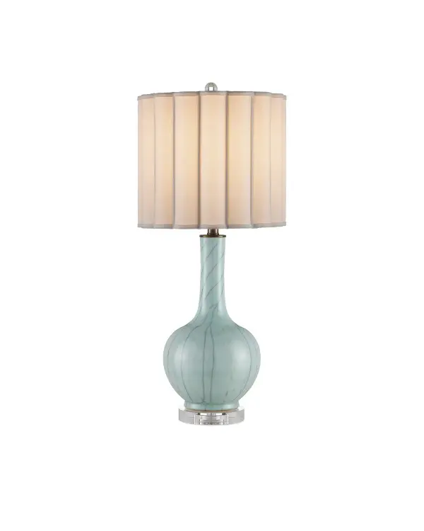 A sophisticated vase-shaped table lamp featuring handcrafted celadon crackle porcelain with unique variations in each piece. The optic crystal base and finial add refined elegance, while the scalloped bone linen shade provides warm, diffused light.