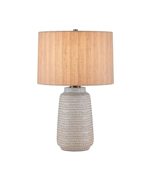 The Owen Table Lamp combines a tone-on-tone textured ceramic base in soft off-white and pale brown with a natural linen shade, creating a warm, organic aesthetic. Antique brass accents add refined elegance to this versatile piece.