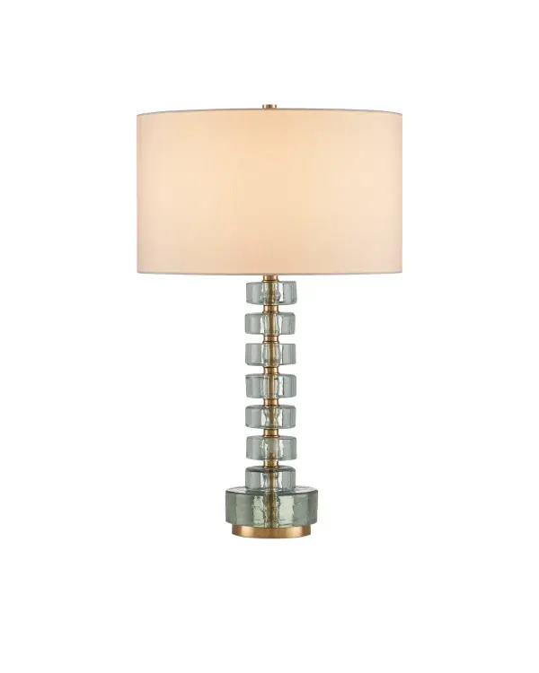 The Mystras combines thick cast glass discs with an antique brass spine for a striking architectural presence. Its substantial weight and quality materials deliver a luxury feel, while the off-white linen shade provides soft, diffused light.