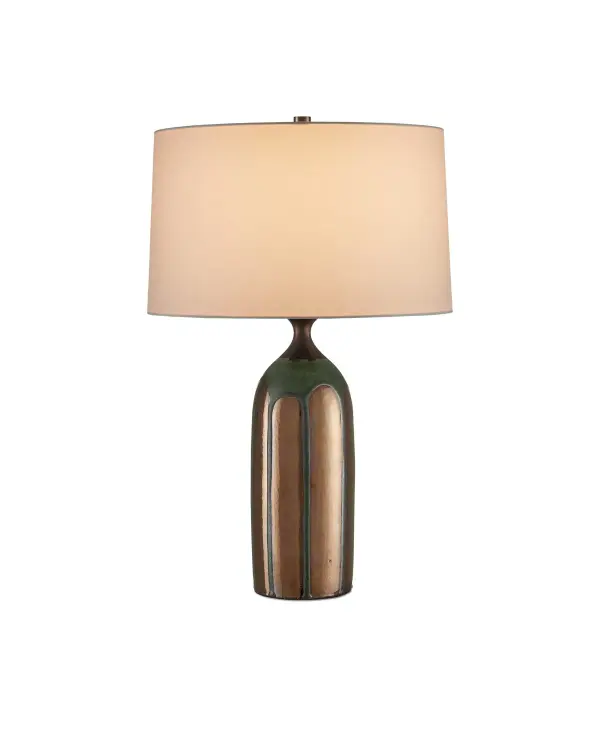 A sculptural ceramic table lamp featuring a striking bottle-shaped form with hand-applied copper and dark green glazes that create a unique dripping effect. The artisanal finish and substantial presence make it a statement piece.
