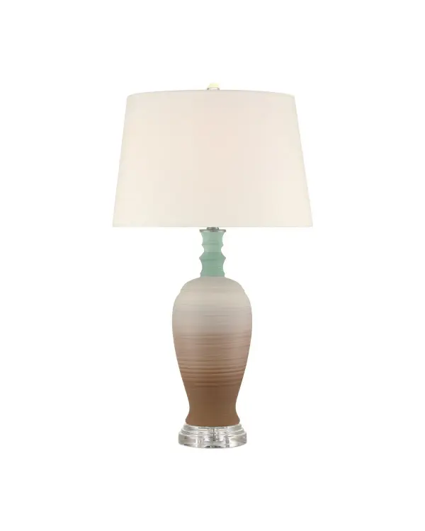 The Happy 80's Table Lamp brings a vibrant, handcrafted aesthetic to any space with its unique striped porcelain base in earthy brown and pale blue. The optic crystal finial and blue-lined shade add sophisticated touches to this playful design.
