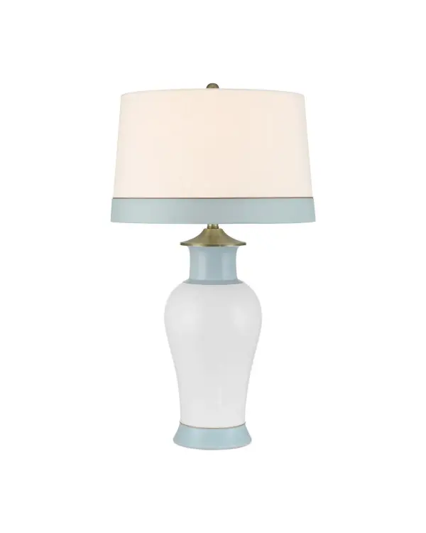 The Kora Blue Table Lamp brings coastal elegance with its hand-painted pale blue stripes on crisp white porcelain. Brushed brass accents and a coordinating shade create a refined, versatile piece perfect for bedrooms and living spaces.