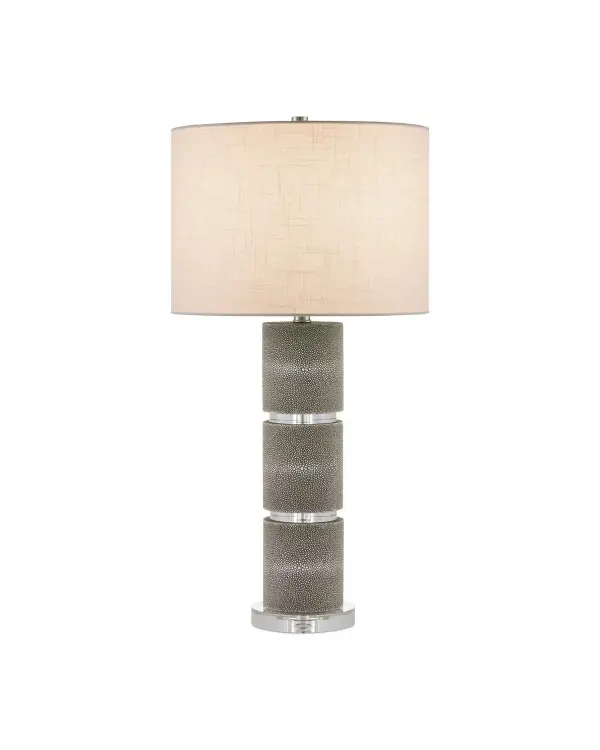 The Lofitt Table Lamp combines faux gray shagreen with optic crystal segments for a sophisticated, high-contrast aesthetic. At nearly 30 inches tall with a slubby linen shade, it delivers refined elegance and substantial presence.