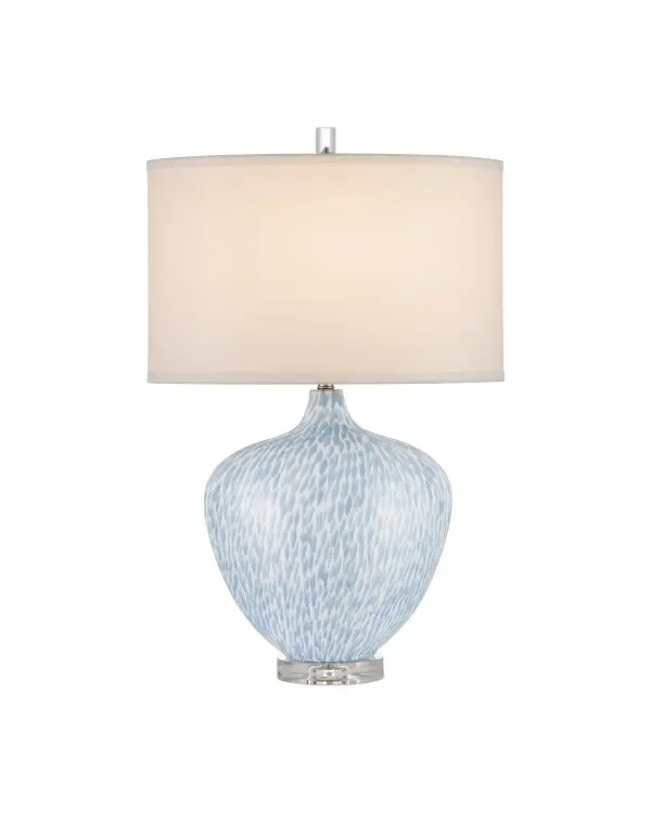 The Tinney Blue Table Lamp combines artistic ceramic craftsmanship with refined crystal accents. Its hand-painted blue brushstrokes evoke flowing plumage against a white ground, creating visual movement and feminine charm. The optic crystal base and finial add brilliance, while the oval shape makes it perfect for narrow surfaces.