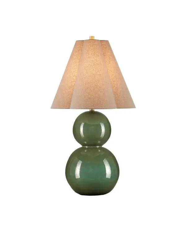The Kindred Table Lamp makes a striking statement with its double-orb ceramic base finished in mottled dark green glaze. The high-gloss sheen creates dramatic luminosity while the unique clover-shaped shade adds unexpected sophistication.