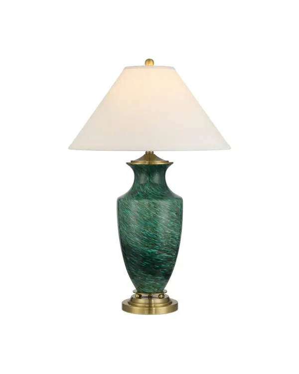 The Claude table lamp features richly striated green glass that creates visual movement and depth. Paired with antique brass hardware and a white linen shade, it brings sophisticated color and texture to transitional and contemporary spaces.