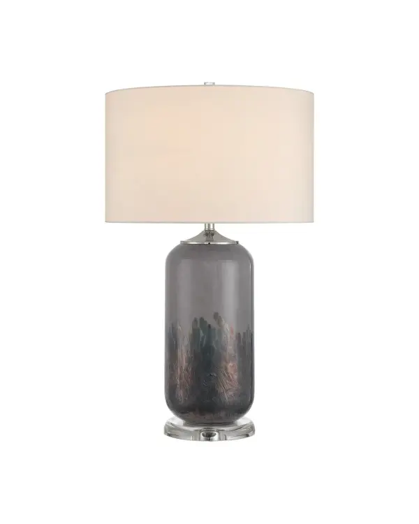 The Lewes Table Lamp features a sophisticated gray glass body with painterly darker gray tones and iridescent glazes, creating visual depth and interest. The polished nickel accents and optic crystal details add refined elegance.
