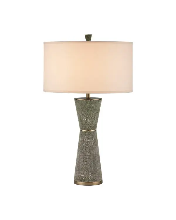 This elegant table lamp combines Art Deco-inspired form with contemporary materials. The hourglass silhouette features textured faux shagreen panels in green, accented by brass metal details and topped with an egg shell linen drum shade.