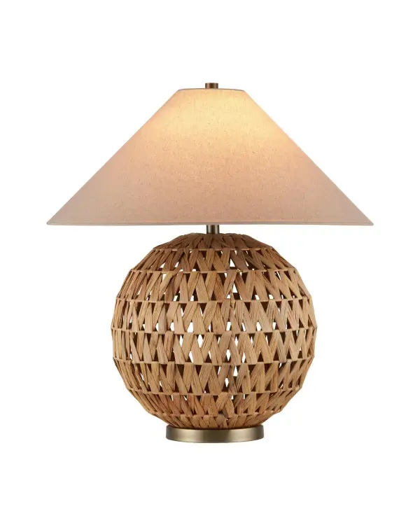 The Casimer table lamp showcases exceptional craftsmanship with hand-wrapped water hyacinth forming a distinctive orb silhouette. The natural material's inherent texture creates visual interest while brass accents add refined warmth. The empire shade completes the design with subtle Asian-inspired sophistication.