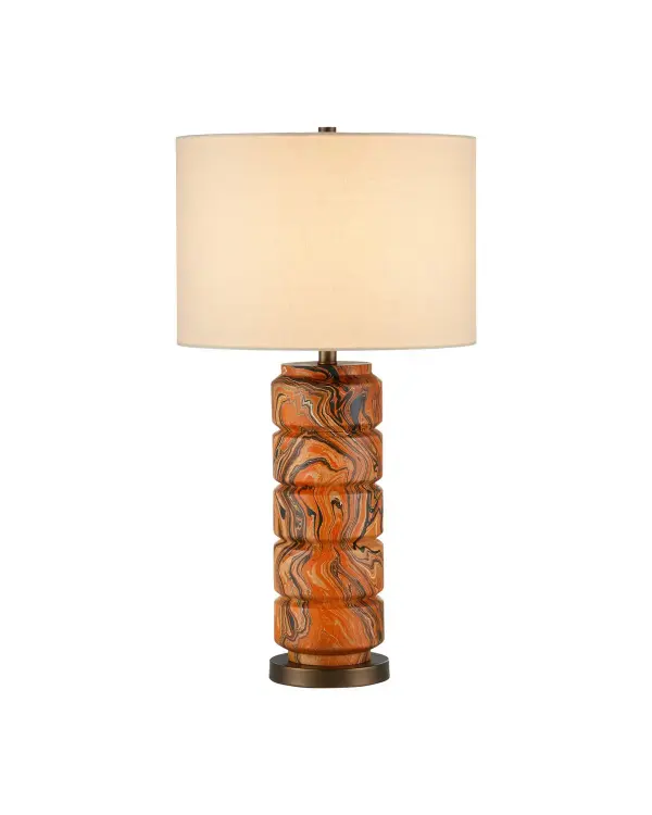 A striking sculptural table lamp featuring hand-carved wood discs with vibrant marbled orange, white, and black finish. Each piece is unique due to the hand-finishing process, making it a true artisan statement piece.