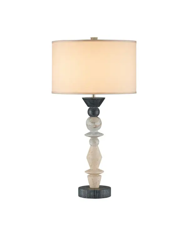 A striking table lamp featuring stacked carved travertine and marble in natural tones with midnight black accents. The sculptural candlestick-inspired form brings organic elegance and substantial presence to any space.