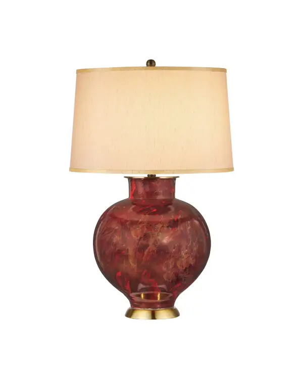 A sophisticated table lamp featuring a porcelain ginger jar body with hand-applied reactive glazes in red and gold tones. The antique brass hardware complements the warm color palette, while the tapered drum shade adds refined elegance.