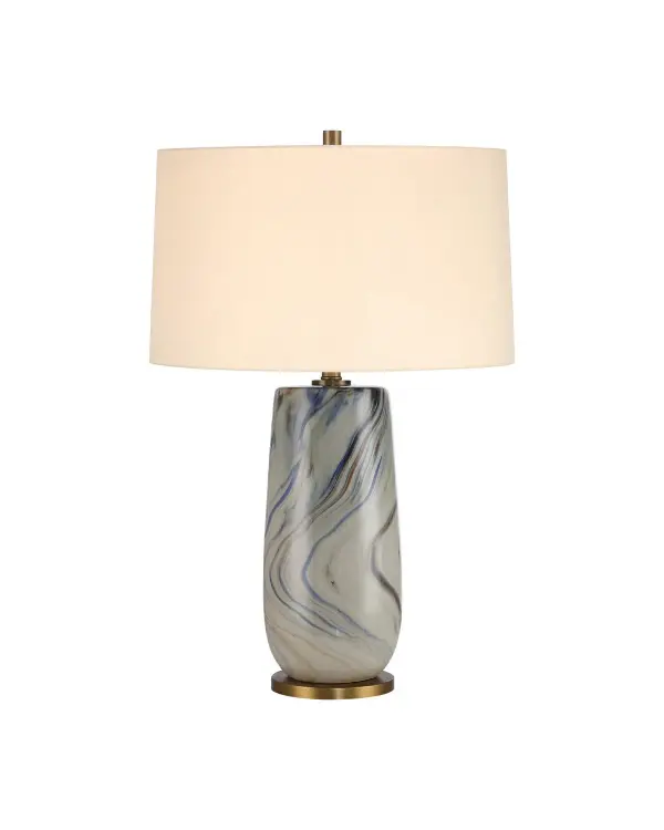 A distinctive table lamp featuring hand-marbled ceramic in gray tones with warm antique brass accents. Each piece is uniquely patterned, making it a true statement piece for transitional and contemporary interiors.