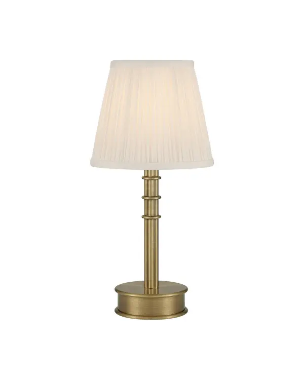 Bunny Williams brings sophisticated portability to this rechargeable table lamp. The polished antique brass finish and geometric detailing create a refined accent piece that works anywhere without cord constraints.