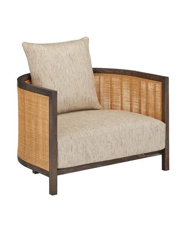 The Celebes Chair combines rich Mindi wood with natural rattan in a design that balances warmth and texture. Its generous proportions and included cushioning make it both visually striking and comfortable for extended sitting.