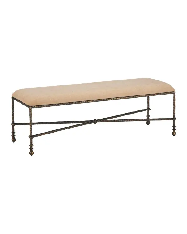 The Fuso Bench combines traditional turned-wood aesthetics with surrealist sculptural details in wrought iron. Its antique bronze finish and dark beige upholstery create a sophisticated accent piece for entryways and bedrooms.