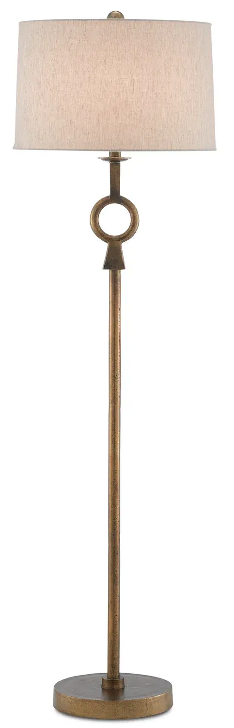 The Germaine Floor Lamp combines transitional elegance with modern simplicity. Its distinctive circlet detail on the aluminum stem creates visual interest, while the antique brass finish adds warmth to any space.