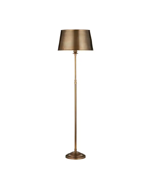 The Callum floor lamp delivers traditional elegance with its solid brass construction and antique brass finish. The fluted base and matching metal shade create a cohesive design that works in both residential and hospitality settings.