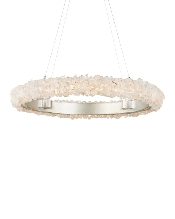 A striking contemporary chandelier featuring natural rock crystal stones delicately wired to a silver leaf frame. The integrated LED provides warm, filtered illumination through the crystals, creating an ice-like luminous effect.
