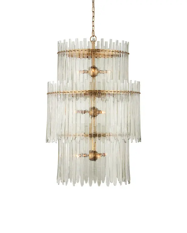 A show-stopping nine-light chandelier featuring handmade glass bars resembling icicles arranged in three tiers around antique brass rings. The 29-inch width and 47-inch height create dramatic vertical presence ideal for high-ceiling spaces.