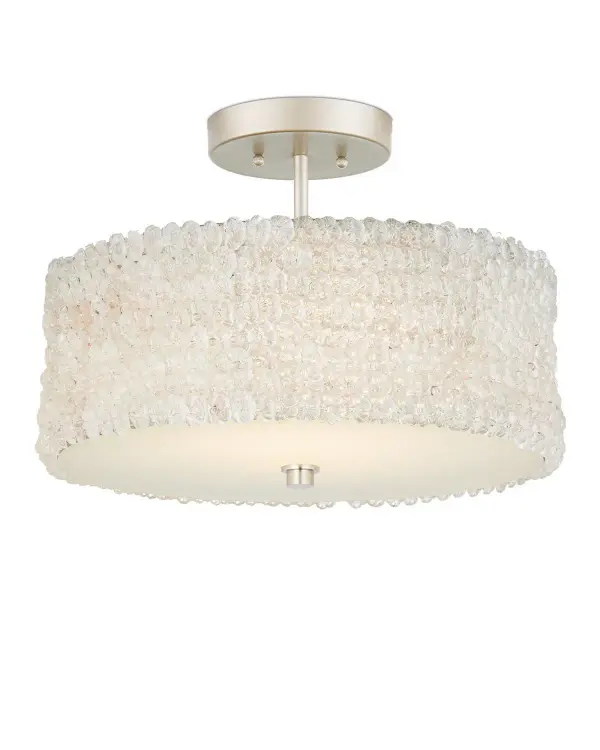 The Florecitas Semi-Flush Mount features hand-pinned clear glass flowers creating a delicate, organic aesthetic. Its nickel finish and 21.5-inch width make it versatile for various residential and hospitality spaces.