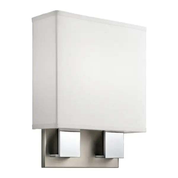 The Santiago LED sconce delivers 880 lumens of warm, diffused light through a white linen shade and acrylic diffuser. Its brushed nickel and chrome ribbon trim adds visual interest while maintaining a clean, contemporary aesthetic perfect for modern bathrooms.