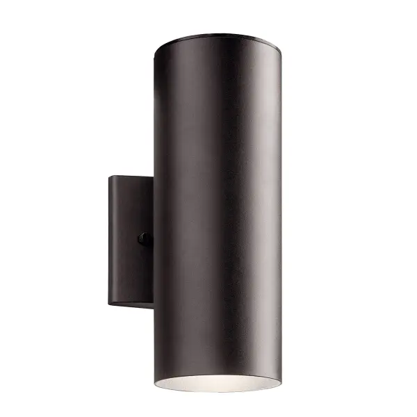 The Cylinder outdoor wall light combines contemporary design with practical functionality. Its textured bronze finish and integrated LED technology deliver energy-efficient illumination with up/down light distribution.